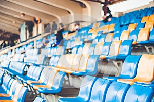 Rows of plastic seats on a grandstand, chair in a stadium, sitting area for spectator