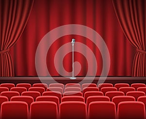 Rows of red cinema or theater seats with microphone