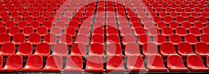 Rows of red football stadium seats with numbers.