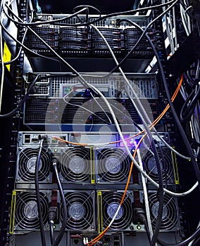 Rows of red network cables connected to router and switch hub in server room at internet data center