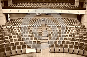 Rows of red plush chairs in the great hall