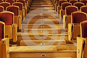 Rows of red theater seats