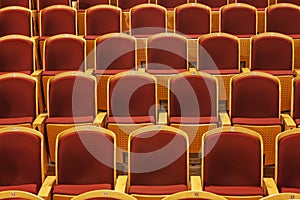 Rows of red theater seats