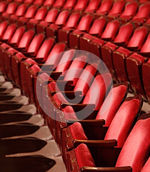 Rows of red velvet theater seats