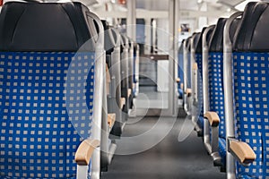 Rows of seats on an empty modern train, travel concept, selective focus