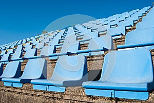 Rows of seats of a small tribune of a stadium