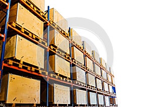 Rows of shelves with boxes in factory warehouse