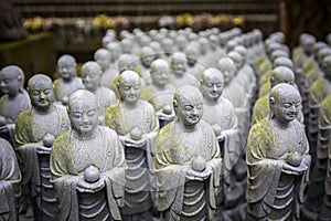 Rows of similar Japanese Jizo sculptures