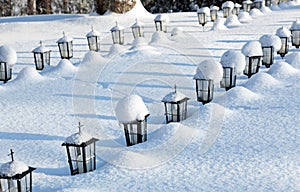 Rows of small lanterns on graveyard