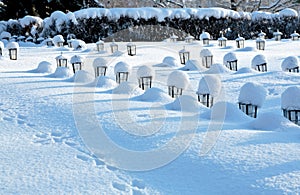 Rows of small lanterns on graveyard