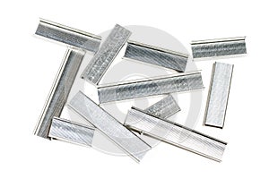 Rows of staples on white background