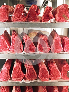 Rows of Steak on Metal Racks