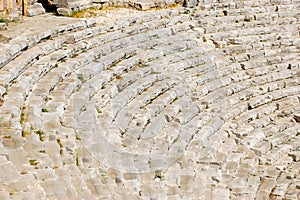 Rows with stone seats, steps, stairs in an ancient amphitheater