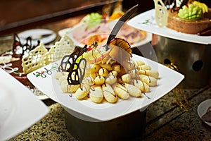 Rows of tasty looking desserts in beautiful arrangements. Sweets on banquet table - picture taken during catering event