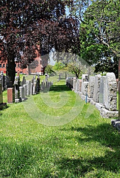 Rows of tombstones in rustic cemetery