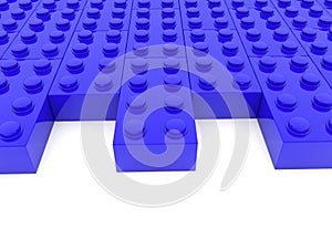 Rows of toy bricks in blue with empty spaces