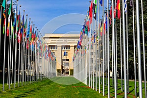 Rows of the United Nations member states flags in front of Palace of United Nations in Geneva, Switzerland
