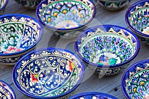 Rows of uzbek cups with traditional uzbekistan ornament, Bukhar