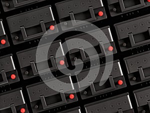 Rows of 12V car batteries