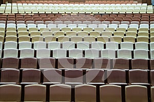 Rows of vacant spectators seats in theater. Abstract background