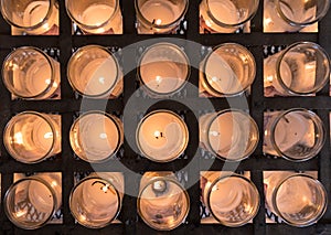 Rows of Votive candles in catholic church