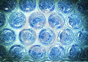 Rows of water in plastic bottles bottom