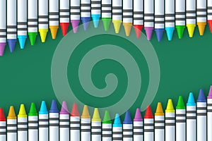 Rows of wax crayons on green background. Colorful pencils. Back to school concept