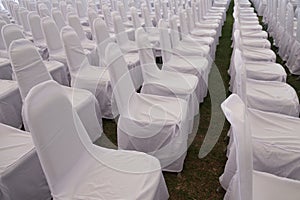 Rows of white chairs in the presentation room