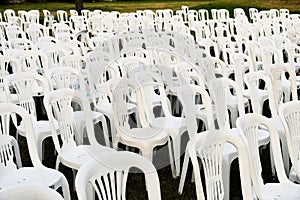 Rows of White Plastic Outdoor Chairs