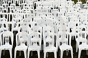 Rows of White Plastic Outdoor Chairs