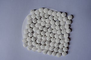Rows of white tablets of vitamin K2