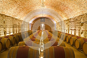 Rows of Wine Barrels in a Cellar