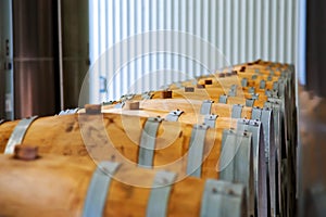 Rows of wine barrels in vaults at the winery.