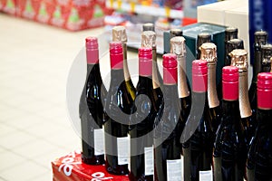 Rows of wine bottles. Wine bottles in the store. Copy space photo