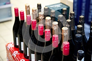 Rows of wine bottles. Wine bottles in the store photo
