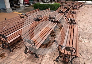 Rows of wooden chairs in the garden