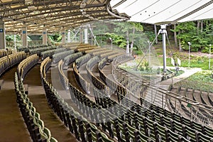 Rows of wooden emty seats