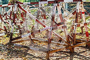 Rows of wooden structures with barbed wire for safety