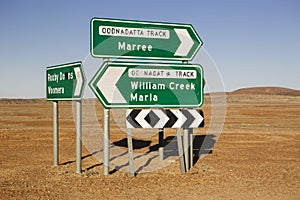 Roxby Downs Woomera, Maree and William Creek Marla signposts in the Australian outback photo