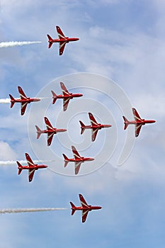 Royal Air Force RAF Red Arrows formation aerobatic display team flying British Aerospace Hawk T.1 Jet trainer aircraft.