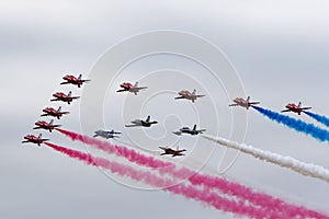 Royal Air Force Red Arrows flying in formation with the leaders of formations teams The Breitling jet Team, Frecce Tricolori,