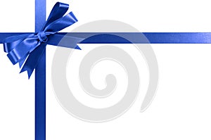 Royal blue gift ribbon bow horizontal corner border isolated on white