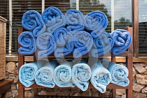 Royal blue towel on wooden shelves