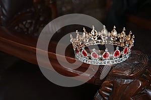 Royal crown with red gems. Ruby, garnet. Symbol of power and authority