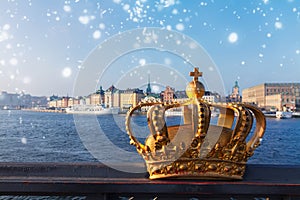 Royal crown and Stockholm cityscape