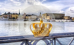 Royal crown and Stockholm old town Gamla Stan, Sweden