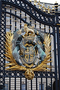 Royal emblem at the gate of Buckingham Palace, London