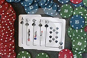 Royal flash poker and blackjacks cards on the dark background