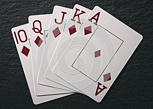 Royal Flush on a black background, a very rare poker hand