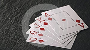 Royal Flush on a black background, a very rare poker hand